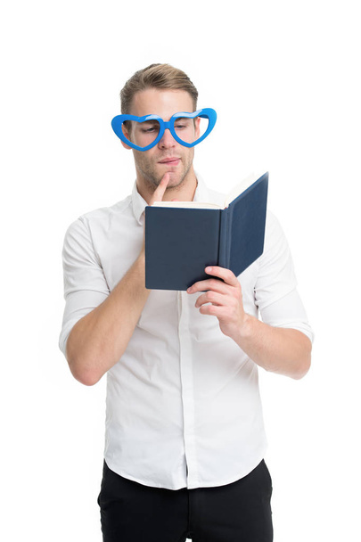Man with book. Study hard. Self improvement literature. University student with lecture notes. Teacher funny guy. Male student reading. Student handsome diligent man. Book nerd wearing cute glasses - Foto, Bild
