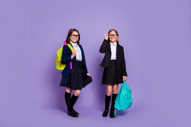 Full length photo of charming classmates hold hand wear trendy stylish eyewear eyeglasses isolated over violet background - Photo, image
