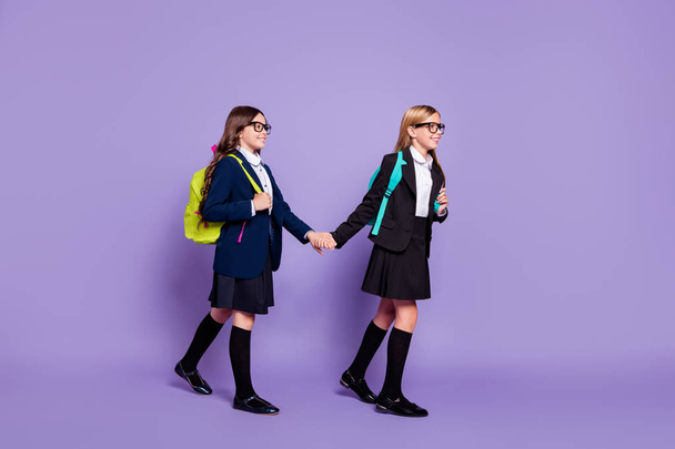 Full body photo of cute children route school courses wear long socks skirt eyewear eyeglasses isolated over violet purple background - Valokuva, kuva