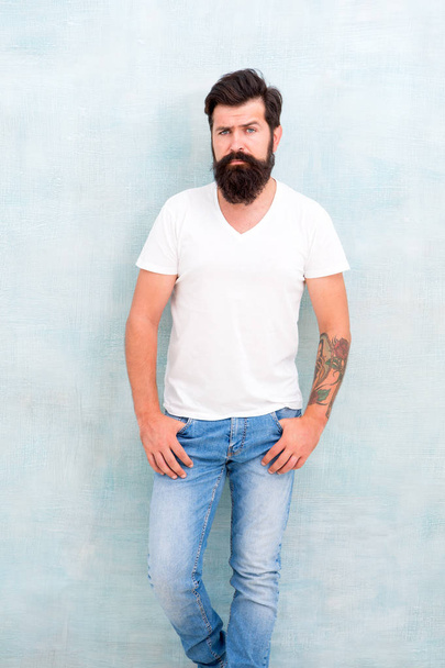 Male temper brutality. Brutal macho casual outfit gray background. Simple and casual. Masculinity concept. Fashion and beauty. Hipster long well groomed beard and mustache. Casual style daily life - Фото, зображення