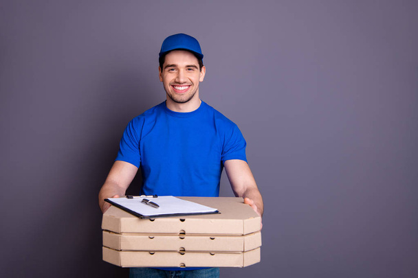 Close up photo express speed specialist he him his delivery boy hold arms parcel boxes propose clipboard customer list here is your order wear blue t-shirt cap corporate suit isolated grey background - Photo, image