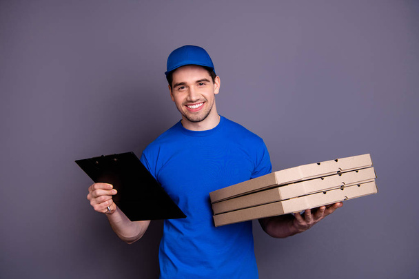 Close up photo express rapid speed specialist he him his delivery boy hold strong arms three parcel boxes clipboard search customer list wear blue t-shirt cap corporate suit isolated grey background - Фото, зображення