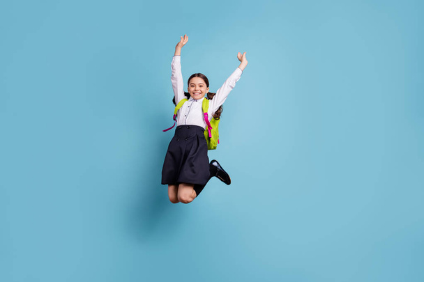 Full size photo of crazy school lady jump high classroom friends 1 september wear white shirt skirt suit isolated blue background - Photo, image