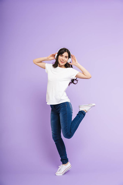 Full length portrait of a cheerful casual woman - Photo, Image
