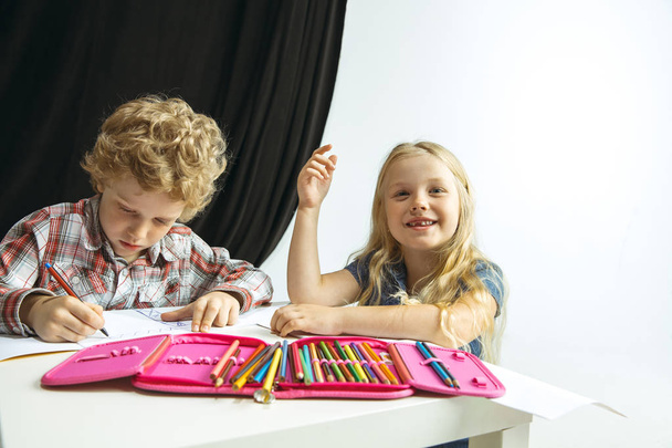 Boy and girl preparing for school after a long summer break. Back to school. - Photo, image