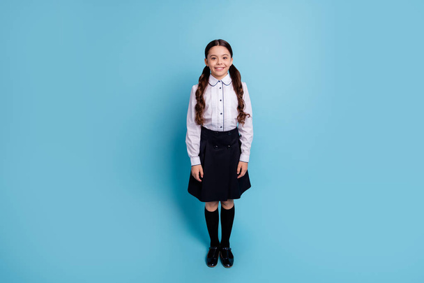 Full length photo of charming kid standing looking isolated over blue background - Zdjęcie, obraz