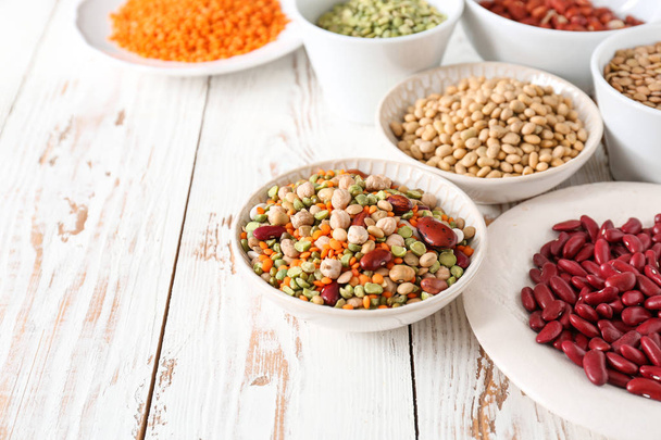 Assortment of legumes on white table - Photo, Image
