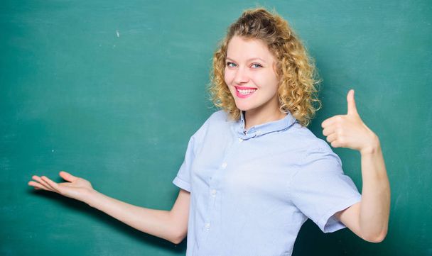 Good teacher master of simplification. Teacher explain hard topic. Important information to remember. Teacher best friend of learners. Teaching could be more fun. Woman teacher in front of chalkboard - Foto, Imagem