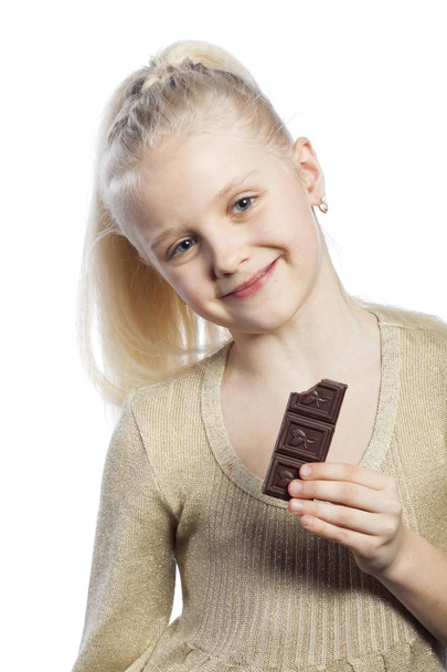 Beautiful girl eating chocolate. - Foto, Bild