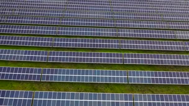 Aerial footage of hundreds solar energy modules or panels rows. Huge Photovoltaic PV Plant in the middle of the desert from an aerial drone point of view - Footage, Video
