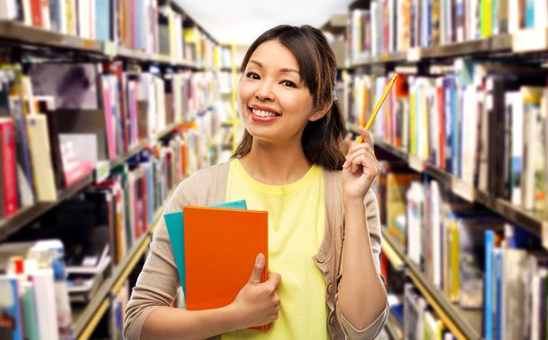 asian student woman with books and pencil - Foto, Imagem