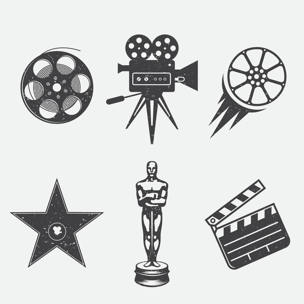 Diferentes iconos para cine y producción en estilo vintage. Cámara de cine, premio estrella, aplaudidor de película, cámara, bobina, cine-película y premio de película
. - Vector, imagen