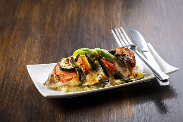 baked chicken breast with mozzarella and vegetables - 写真・画像