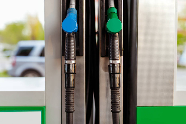 Gas nozzles on pump of filling station - 写真・画像