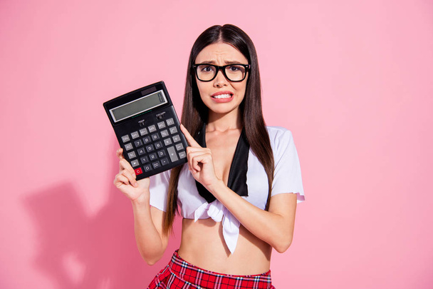 Photo of pretty lady hold calculator spend salary have no money for living wear white top short skirt isolated pink background - Fotografie, Obrázek