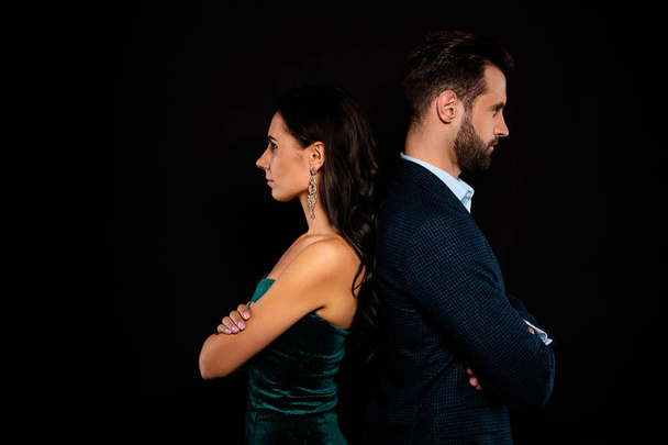 Close up side profile photo amazing pair she her classy he him his macho stand back to back confrontation arms crossed wear blue costume jacket green glossy velvet dress isolated black background - Foto, Bild