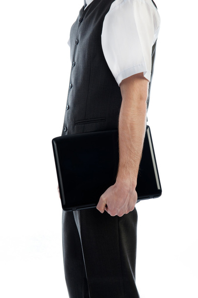 Businessman holding a laptop - 写真・画像