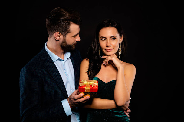 Portrait of his he her she nice-looking attractive lovely luxury adorable pretty shine fascinating dreamy two person guy giving handling cool expensive package isolated over black background - Photo, Image
