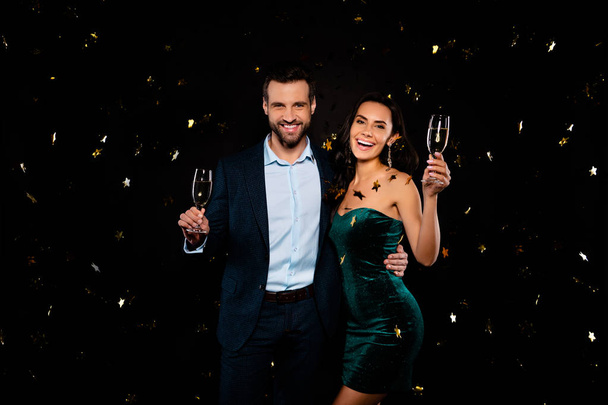 Portrait of his he her she nice well-dressed fascinating attractive classy glamorous luxurious smart cheerful glad positive two person flying decorative elements rejoice isolated on black background - Zdjęcie, obraz