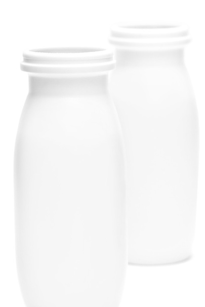 Two jars with milk over white - Foto, Bild