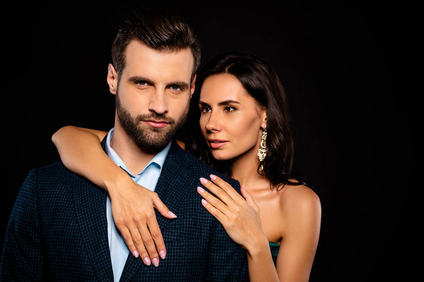 Close up photo beautiful she her wife he him his husband full feelings married spouse celebrities piggyback pose hold hands arms chest wear costume jacket green dress isolated black background - Foto, imagen