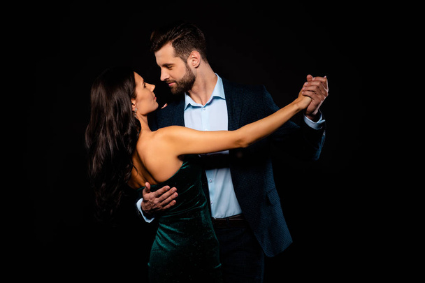 Close up back rear behind photo beautiful she her wife he him his husband mrs mr married spouse hold hands tango slow dance position gentle wear costume jacket green dress isolated black background - Φωτογραφία, εικόνα