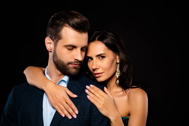 Close up photo beautiful she her wife he him his husband married spouse celebrities piggyback pose hold hands chest erotic dream fantasy wear costume jacket green dress isolated black background - Foto, Imagem