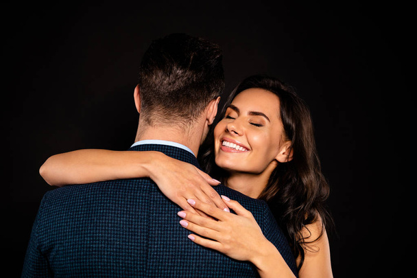 Close up back rear behind photo beautiful she her classy lady wife eyes closed he him his husband mrs mr married spouse slow dance hands shoulders wear costume jacket dress isolated black background - Фото, зображення