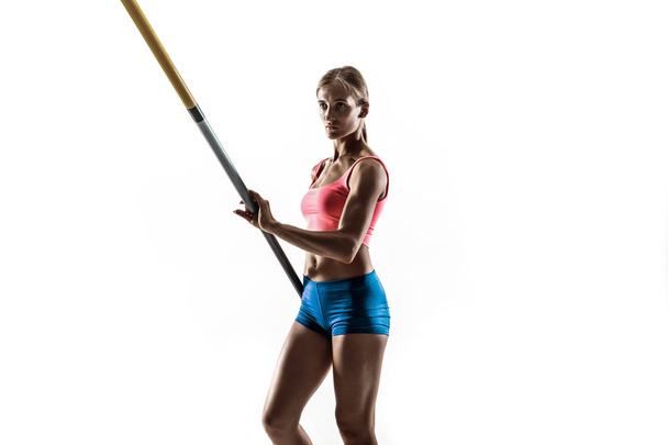 Female pole vaulter training on white studio background - Foto, imagen