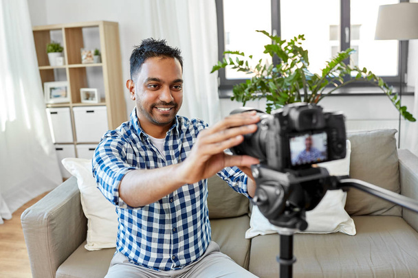 indian male video blogger adjusting camera at home - Fotoğraf, Görsel