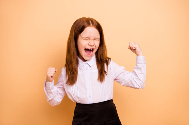 Portrait of nice attractive lovely crazy cheerful cheery overjoyed pre-teen girl great cool news dream attainment accomplishment rejoicing isolated over beige pastel background - Foto, imagen