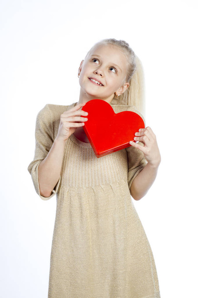 Beautiful girl holding heart in arms. - Foto, Imagem
