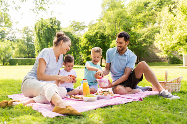 happy family having picnic at summer park - Photo, Image