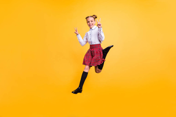 Full length body size view of her she nice attractive lovely cheerful cheery positive pre-teen girl having fun free time showing double v-sign enjoy isolated over bright vivid shine yellow background - Zdjęcie, obraz