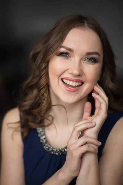 Closeup portrait of attractive young woman smiling - Фото, изображение