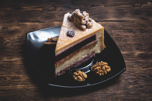 A piece of cake on a plate. - 写真・画像