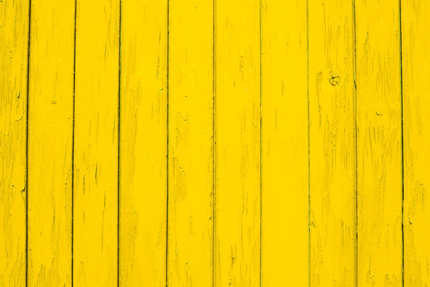 The texture of yellow wood Board can be used for background. The old wooden background on the top view of the natural wood from the forest show the texture of the original wood. A little cracked paint - Фото, изображение
