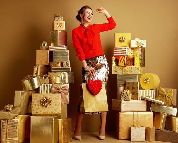 fashion-monger with shopping bag and red heart having fun time - Fotó, kép