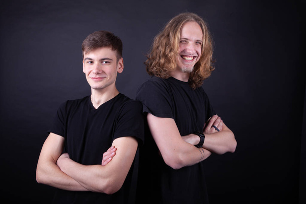 Rock band consisting of two young caucasian adults posing in the - Foto, afbeelding