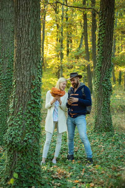 Outdoor autumn portrait Gorgeous couple models with sunny day light. Portrait of beautiful woman and man walking outdoors. Sensual couple enjoying intimacy. - Φωτογραφία, εικόνα
