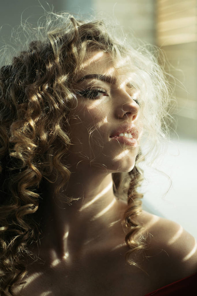Pretty woman. Shiny curly hair .Curly hair woman. Beautiful hair, portrait of an young girl. Charming woman. Wavy Hair. Beautiful Sexy Blonde Woman. - Photo, image