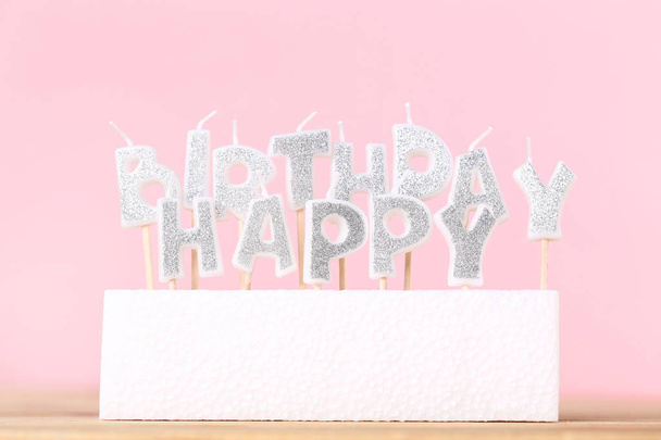 Happy Birthday candles on pink background - Φωτογραφία, εικόνα