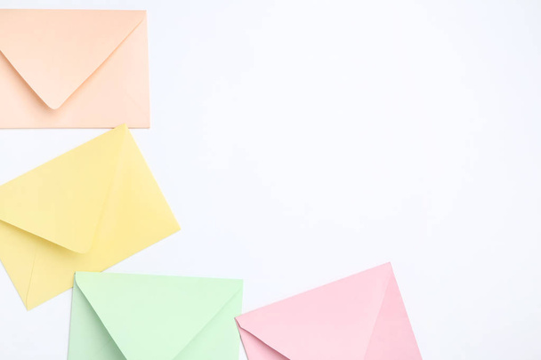 Colorful paper envelopes on white background - Fotoğraf, Görsel