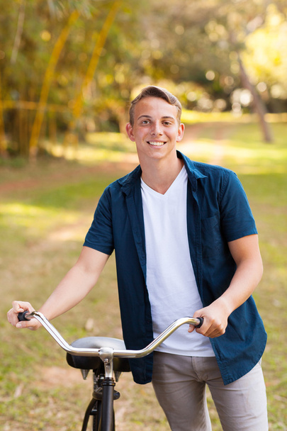 young teenage boy with bike - Фото, изображение