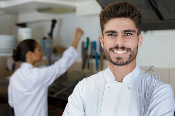 happy chef cook at restaurant kitchen - Фото, изображение