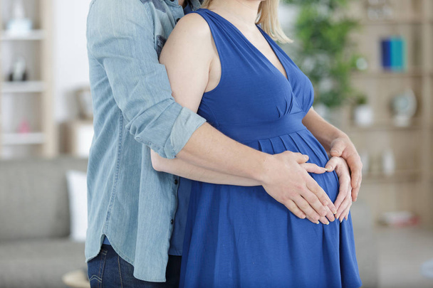 pregnant couple hug pregnant belly - Foto, imagen