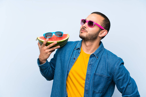 Colombian man holding a watermelon with sunglasses - Foto, Imagem