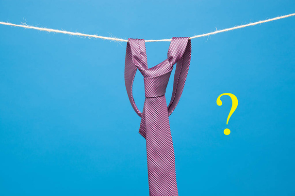 Tie is an element of the way of dressing of many professions, bankers, financiers, managers, executives, etc ... Tie knotted and hung from a rope held by clothespin. Classic way of dressing, - Photo, Image