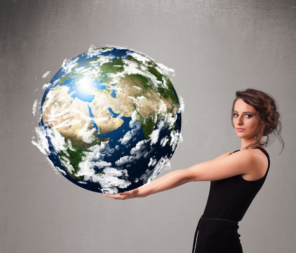 Pretty girl holding 3d planet earth - Photo, image