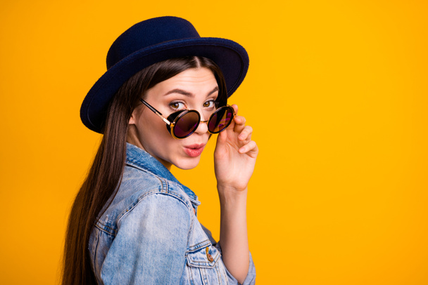 Close-up profile side view portrait of nice cute attractive sweet lovable fascinating cheerful optimistic straight-haired lady touching glasses flirt isolated on bright vivid shine yellow background - Fotó, kép